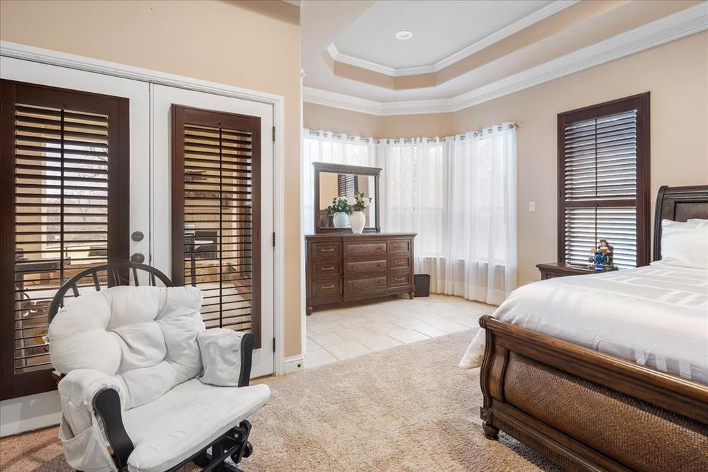 117 Redtail Court Weatherford, TX 76088 - Photo 22 of 39 a bedroom with a bed and a couch