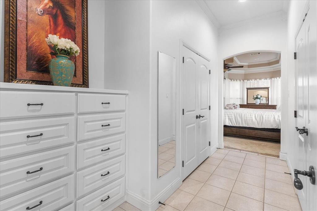 117 Redtail Court Weatherford, TX 76088 - Photo 23 of 39 a view of a bedroom with closet and cabinet