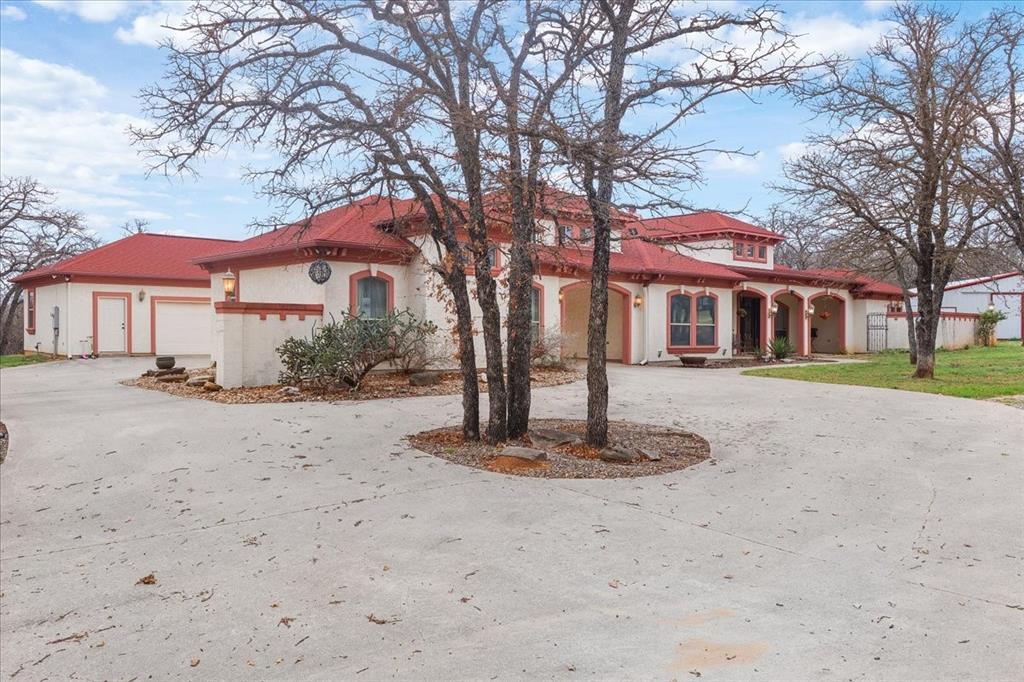 117 Redtail Court Weatherford, TX 76088 - Photo 3 of 39 a front view of a house with a yard