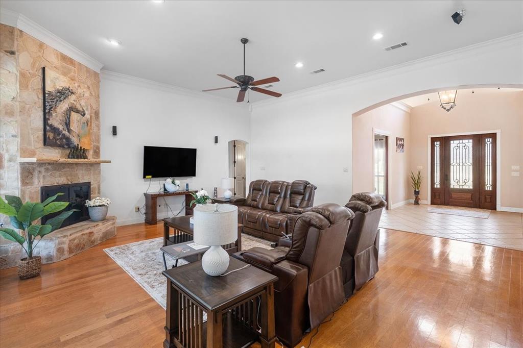 117 Redtail Court Weatherford, TX 76088 - Photo 8 of 39 a living room with furniture a flat screen tv and kitchen view