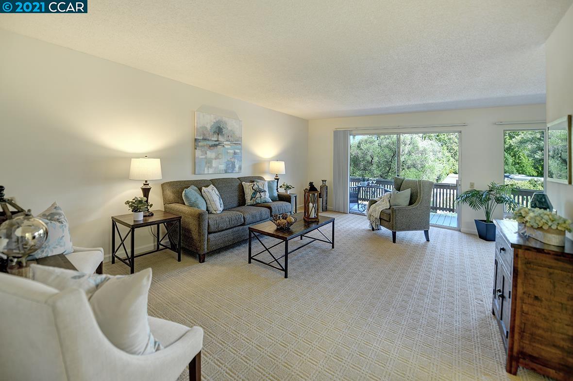 1388 Rockledge Lane, Unit 4 Walnut Creek, CA 94595 - Photo 1 of 1 a living room with furniture and a large window