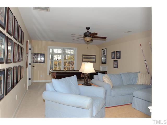 5801 Orchid Valley Road Raleigh, NC 27613 - Photo 13 of 25 a living room with furniture and a large window