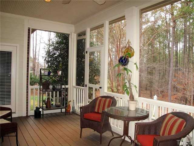 5801 Orchid Valley Road Raleigh, NC 27613 - Photo 14 of 25 a living room with furniture and a floor to ceiling window