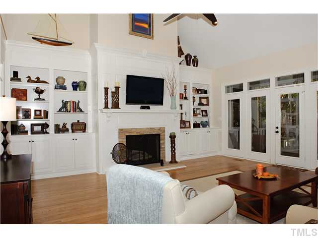 5801 Orchid Valley Road Raleigh, NC 27613 - Photo 5 of 25 a living room with furniture a flat screen tv and a fireplace