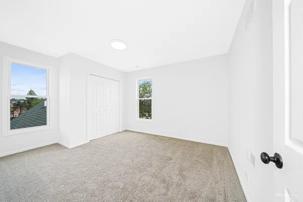 an empty room with windows
