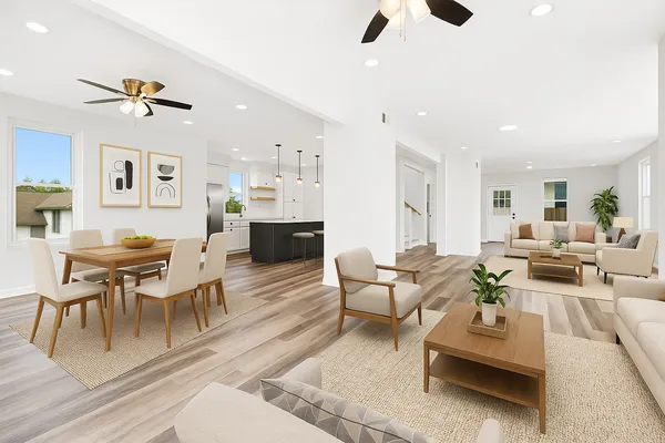 a living room with furniture a rug and white walls