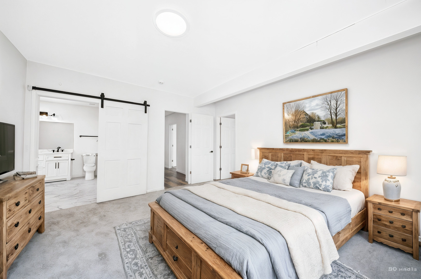 18445 Kedzie Avenue Homewood, IL 60430 - Photo 8 of 37 a spacious bedroom with a bed and a flat screen tv