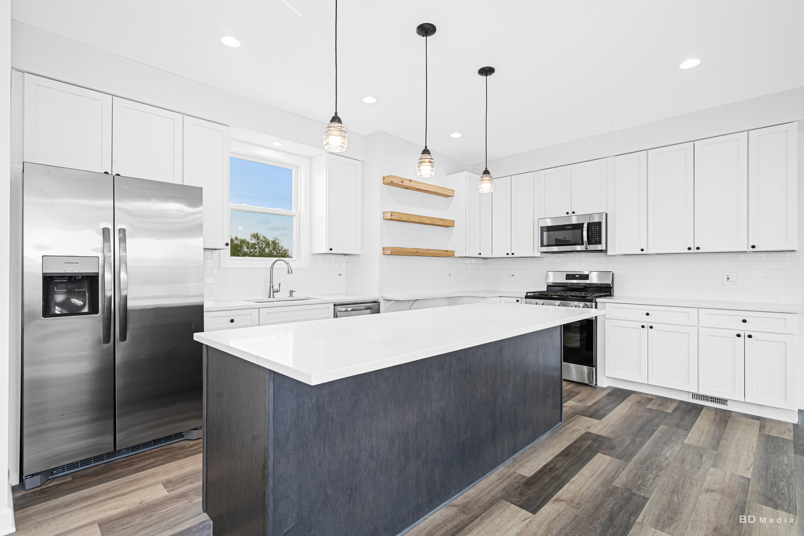 18445 Kedzie Avenue Homewood, IL 60430 - Photo 10 of 37 a kitchen with stainless steel appliances granite countertop a sink a stove a refrigerator and island with wooden floor