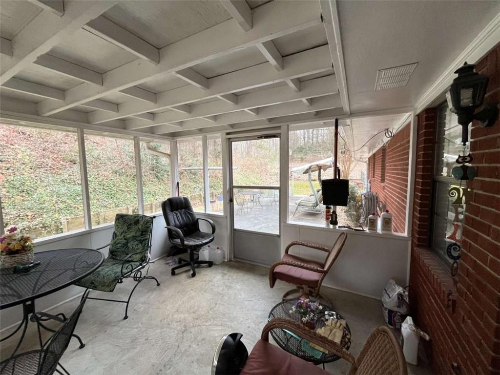 33 East Kenora Drive Southwest Rome, GA 30165 - Photo 14 of 30 a living room with furniture tv and a floor to ceiling window