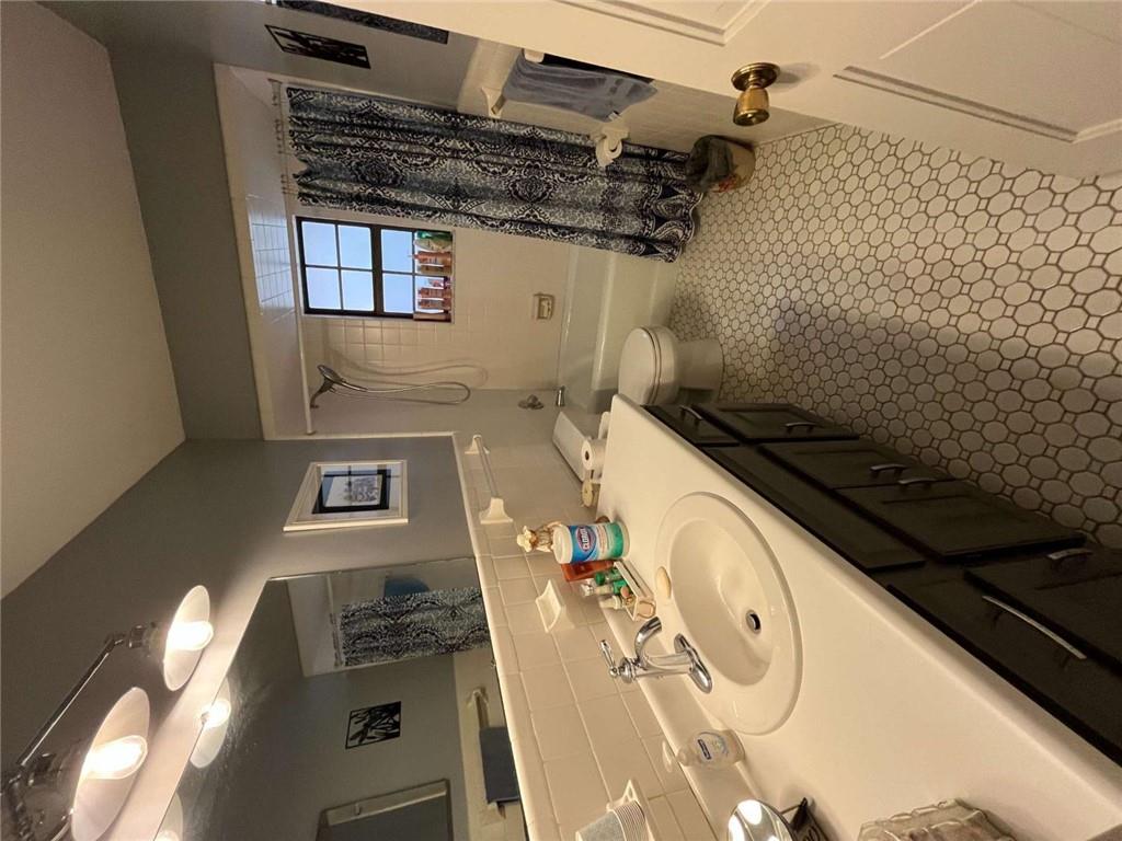 33 East Kenora Drive Southwest Rome, GA 30165 - Photo 18 of 30 a bathroom with a double vanity sink and a mirror