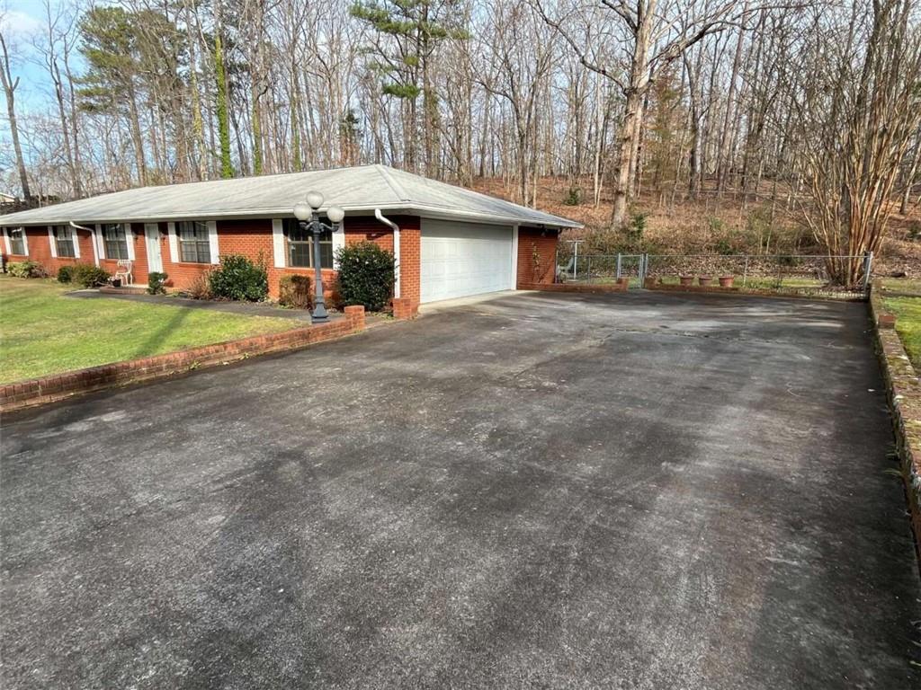 33 East Kenora Drive Southwest Rome, GA 30165 - Photo 29 of 30 front view of a house with a yard