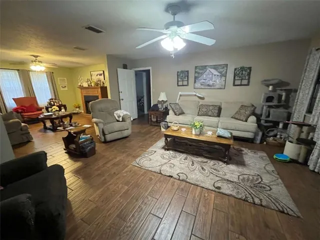 a living room with furniture or couch and a chandelier