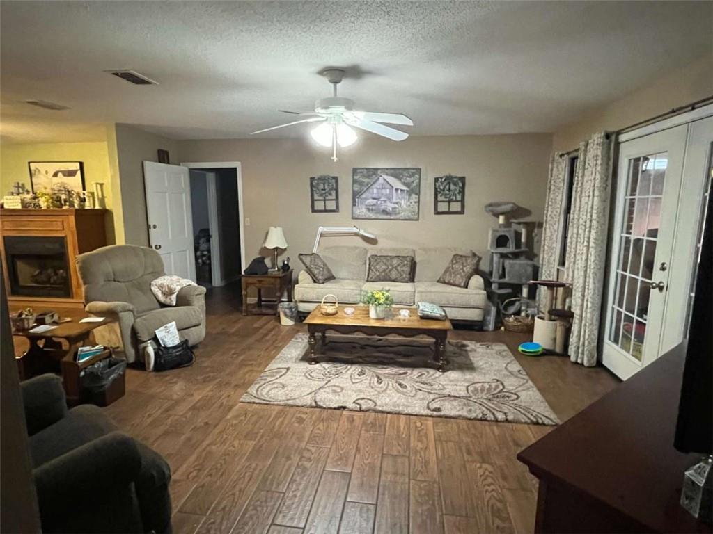 33 East Kenora Drive Southwest Rome, GA 30165 - Photo 10 of 30 a living room with furniture and a chandelier