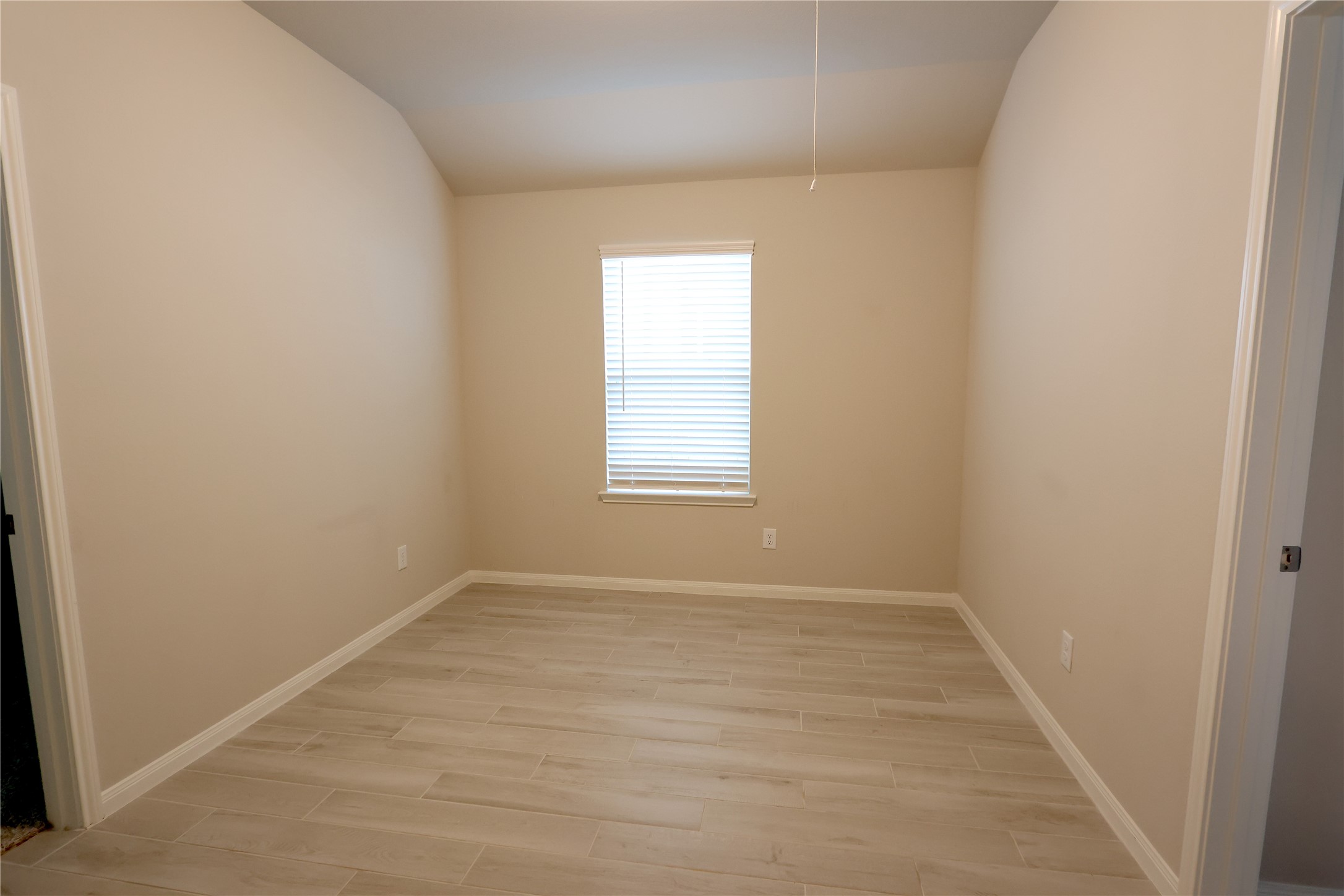 906 Pismo Lane Rosharon, TX 77583 - Photo 11 of 15 wooden floor in an empty room with a window