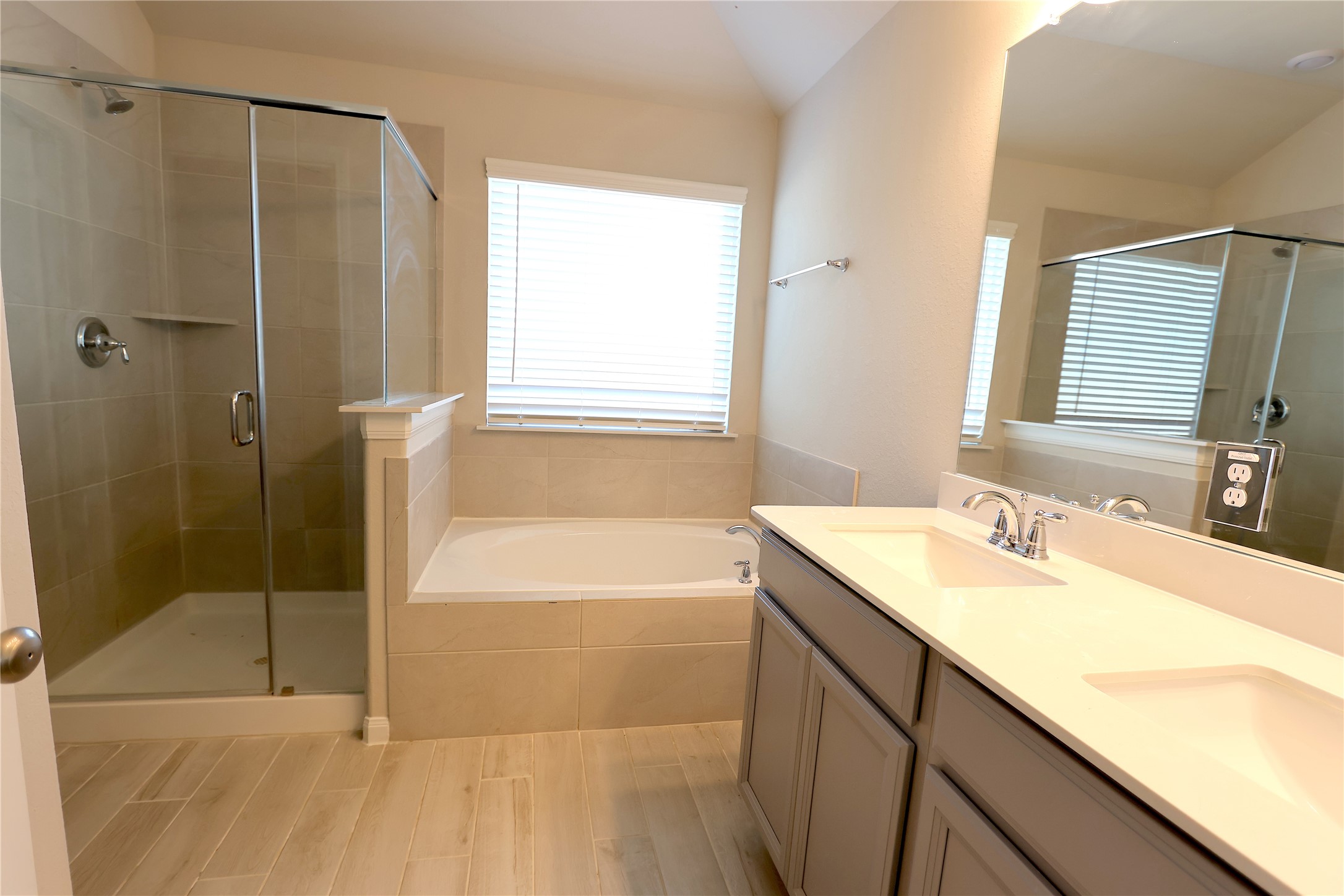 906 Pismo Lane Rosharon, TX 77583 - Photo 8 of 15 a bathroom with a tub sink shower and a mirror
