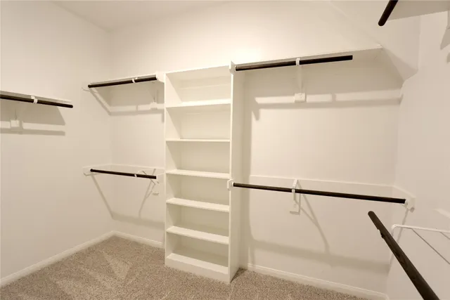 a view of an empty walk in closet