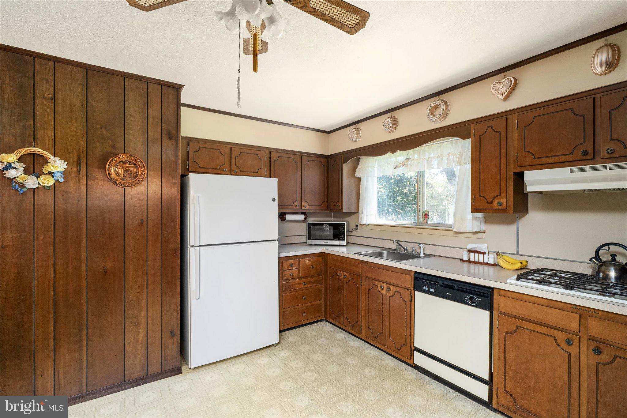 18 Compton Way Hamilton, NJ 08690 - Photo 13 of 28 a kitchen with a sink a refrigerator and window