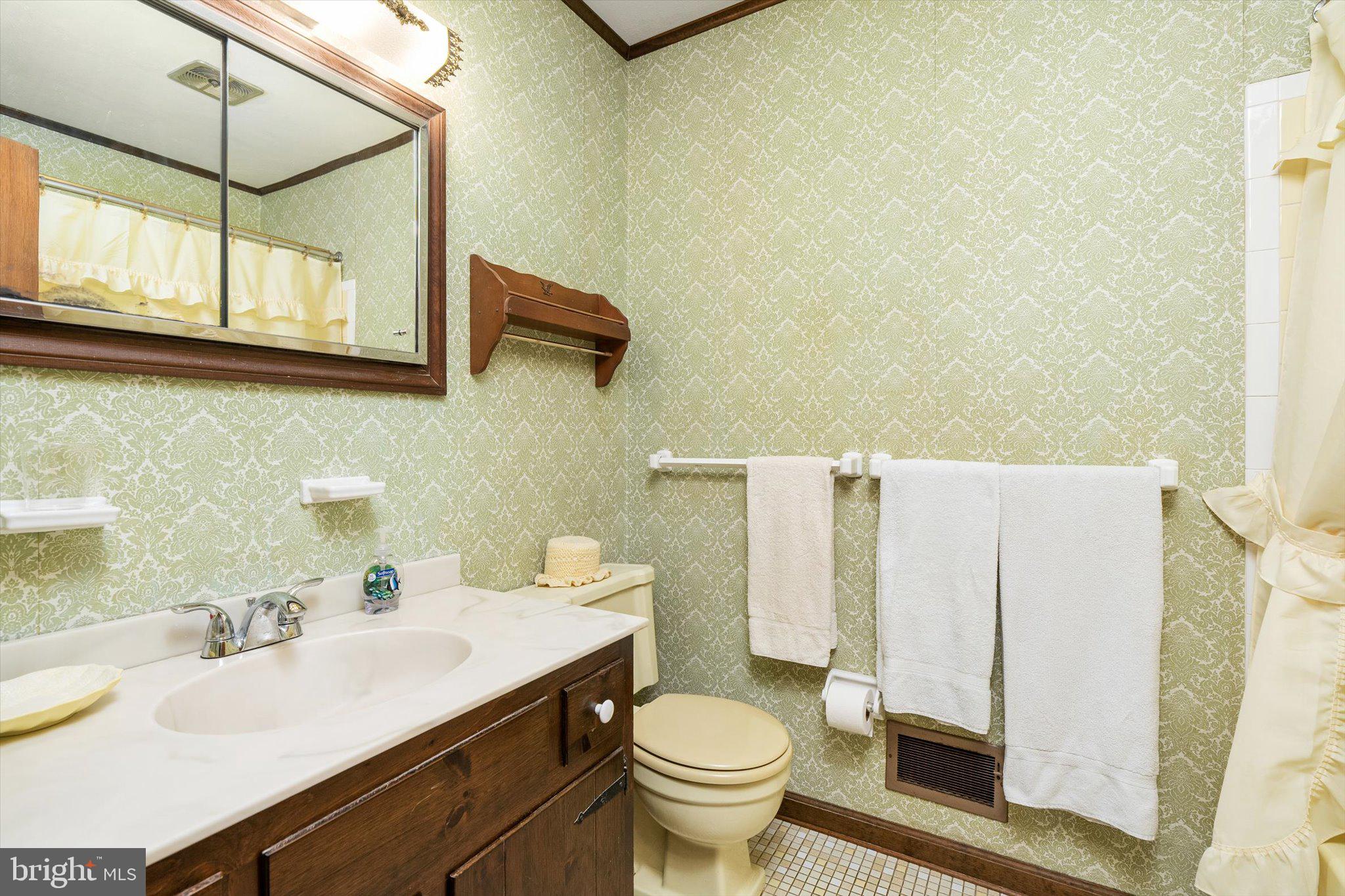 18 Compton Way Hamilton, NJ 08690 - Photo 15 of 28 a bathroom with a sink a toilet and mirror