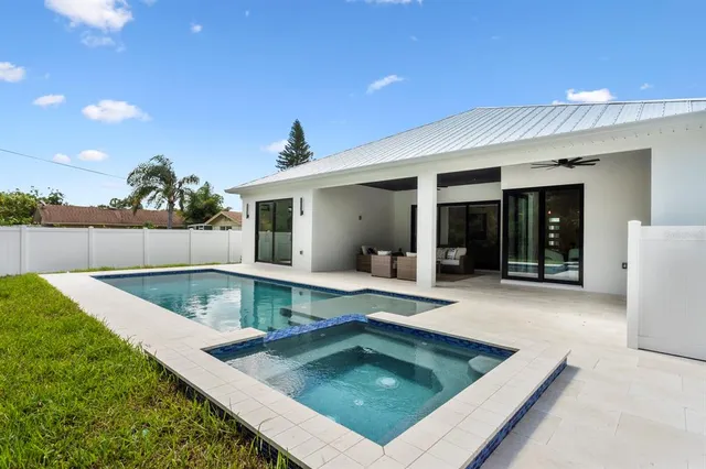 a view of swimming pool with chairs