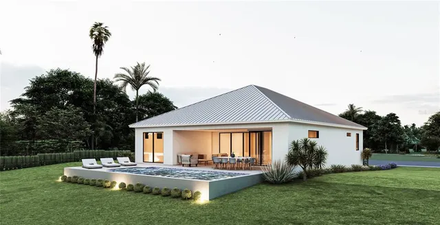 a front view of house with a garden and patio