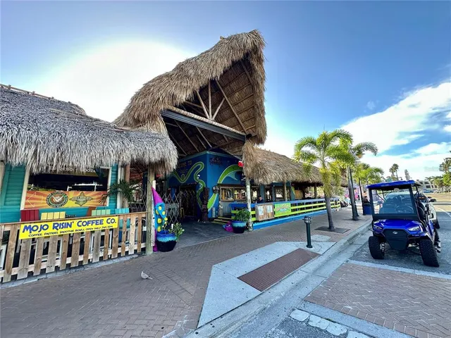 a blue swimming pool with an outdoor seating