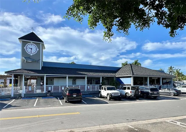 a street sign on a sidewalk next to a road