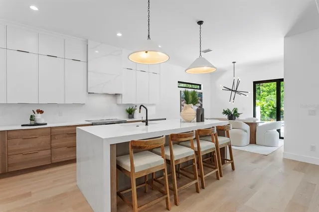 a kitchen with a table and chairs in it