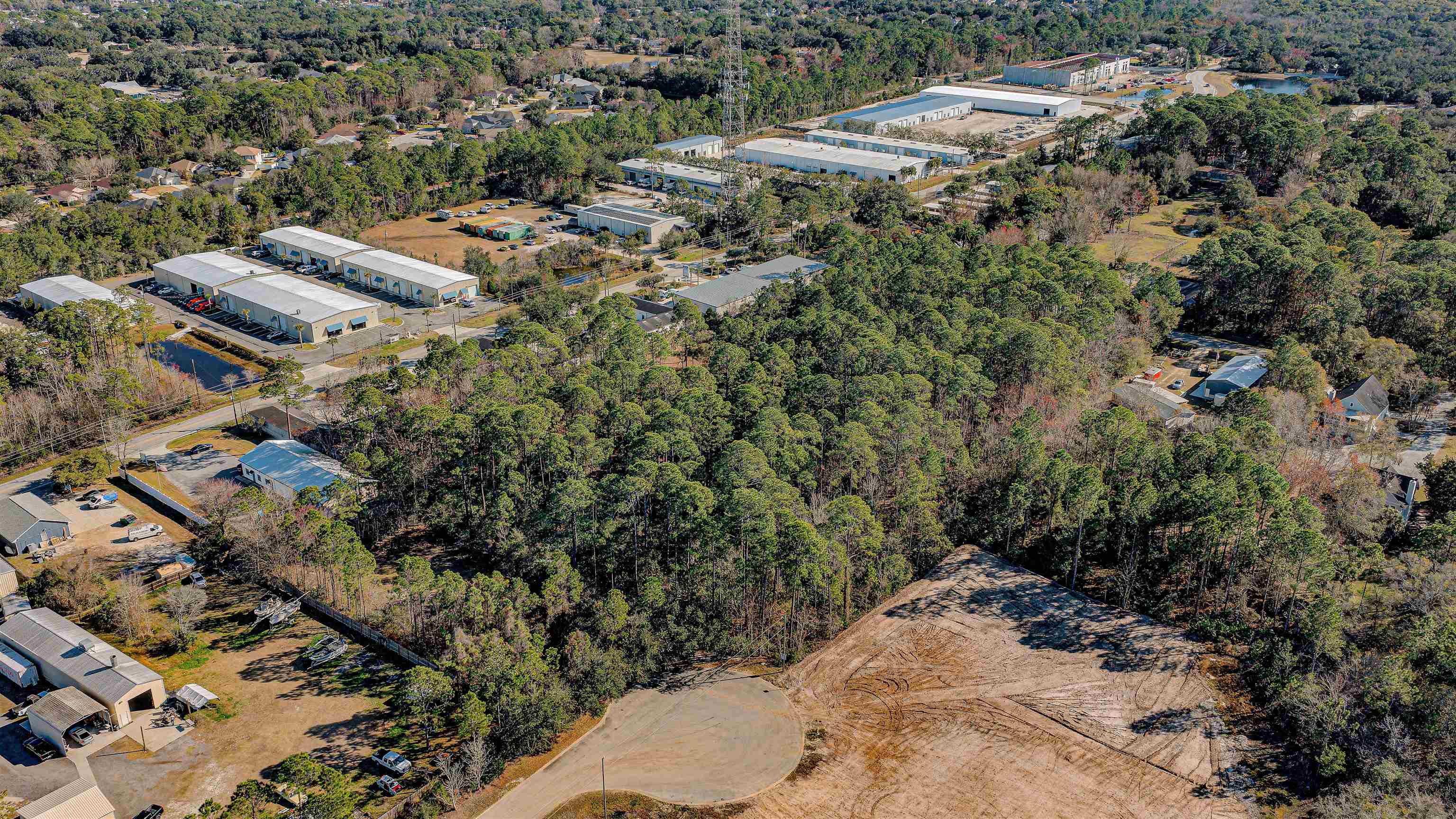 724 Cypress Road St. Augustine, FL 32086 - Photo 7 of 7 Aerial view of property and surrounding area featuring a heavily wooded area