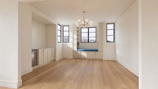 a view of a brick house with large windows