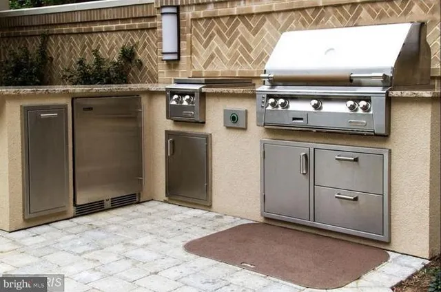 a kitchen with a stove and a refrigerator