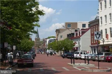 a city street lined with buildings and trees