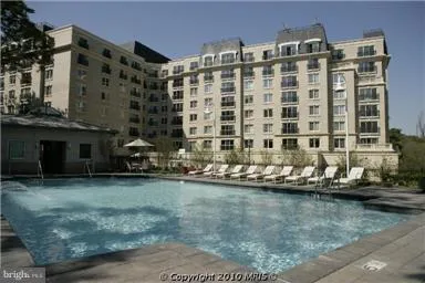 a front view of a building with swimming pool