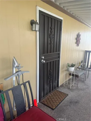 a living room with furniture rug and a window