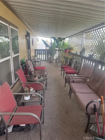 a view of a chairs and table in patio