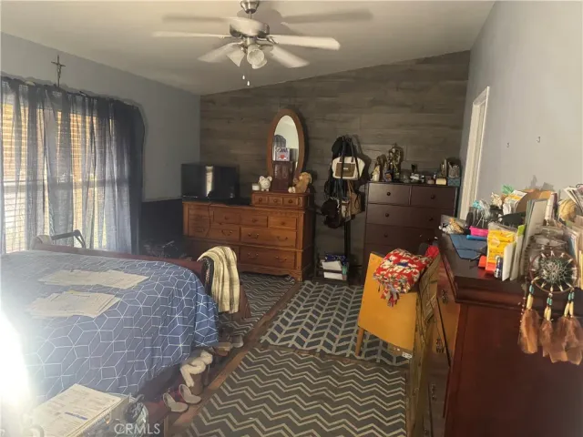 a bedroom with furniture and a chandelier