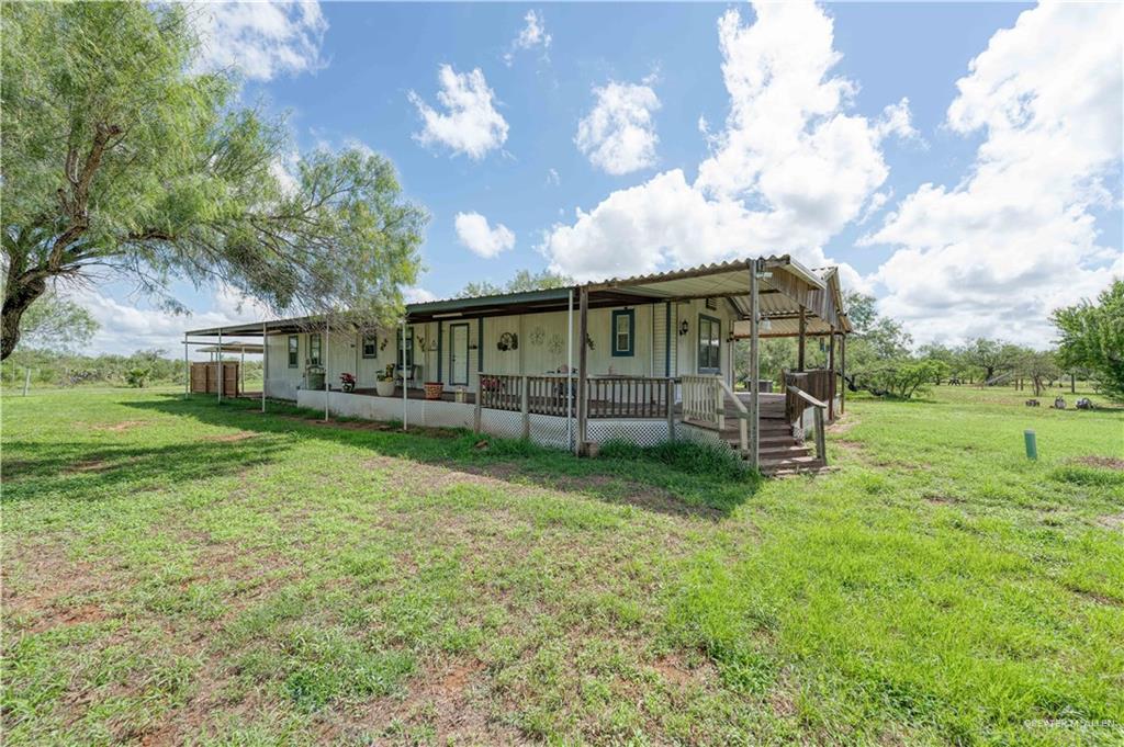 220 Delmita Road Delmita, TX 78536 - Photo 17 of 33 a view of a house with a yard