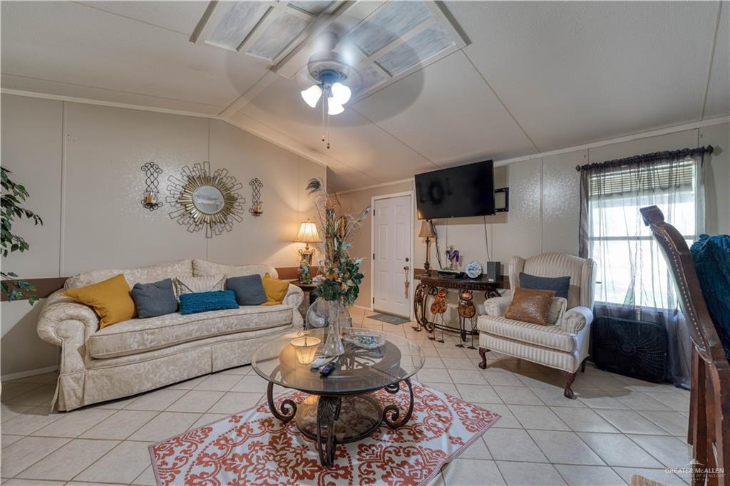 220 Delmita Road Delmita, TX 78536 - Photo 21 of 33 a living room with furniture and a flat screen tv