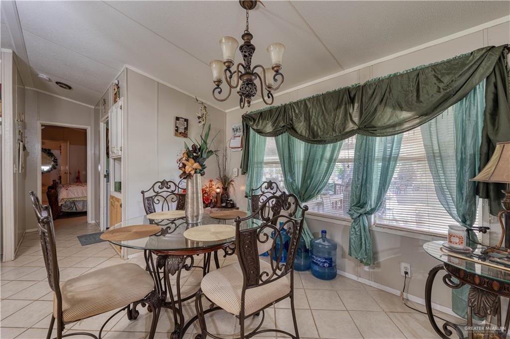 220 Delmita Road Delmita, TX 78536 - Photo 22 of 33 a view of a dining room with furniture window and outside view