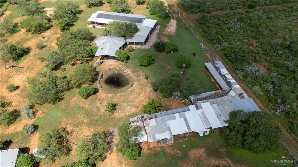 220 Delmita Road Delmita, TX 78536 - Photo 5 of 33 an aerial view of a house with a yard and lake view