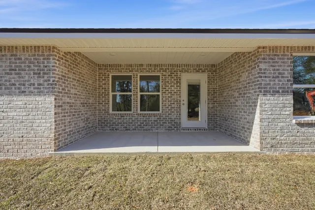 a view of a brick house with an empty space