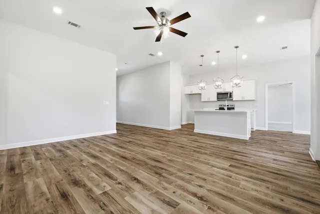 a view of a kitchen with a sink and a stove