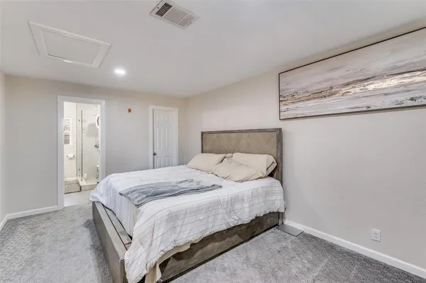 a bedroom with a bed and a walk in closet