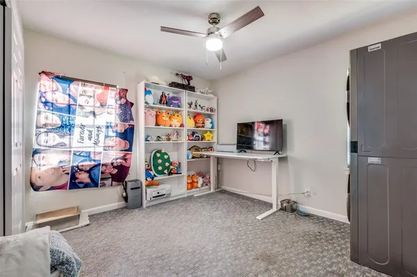 a bedroom with furniture and a window