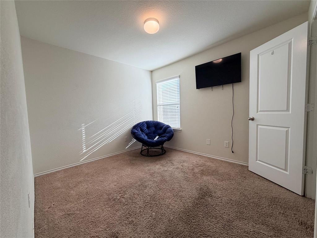 2203 Vance Drive Forney, TX 75126 - Photo 16 of 23 Unfurnished room with carpet floors and a textured ceiling