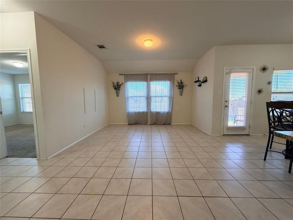 2203 Vance Drive Forney, TX 75126 - Photo 8 of 23 Spare room featuring light tile patterned flooring and baseboards