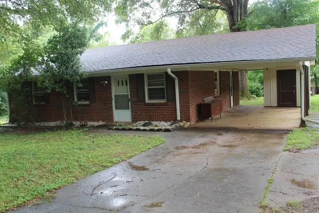 a view of a house with a garden