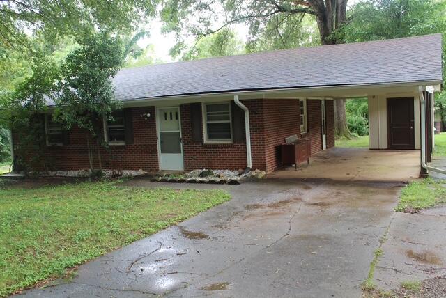 a view of a house with a garden