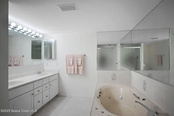 a bathroom with a toilet and shower