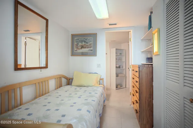 a view of storage and utility room with washer and dryer
