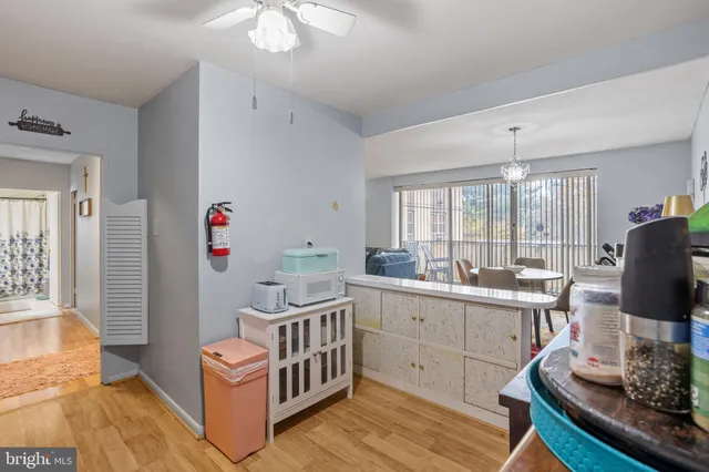 a room with furniture a flat screen tv and a window